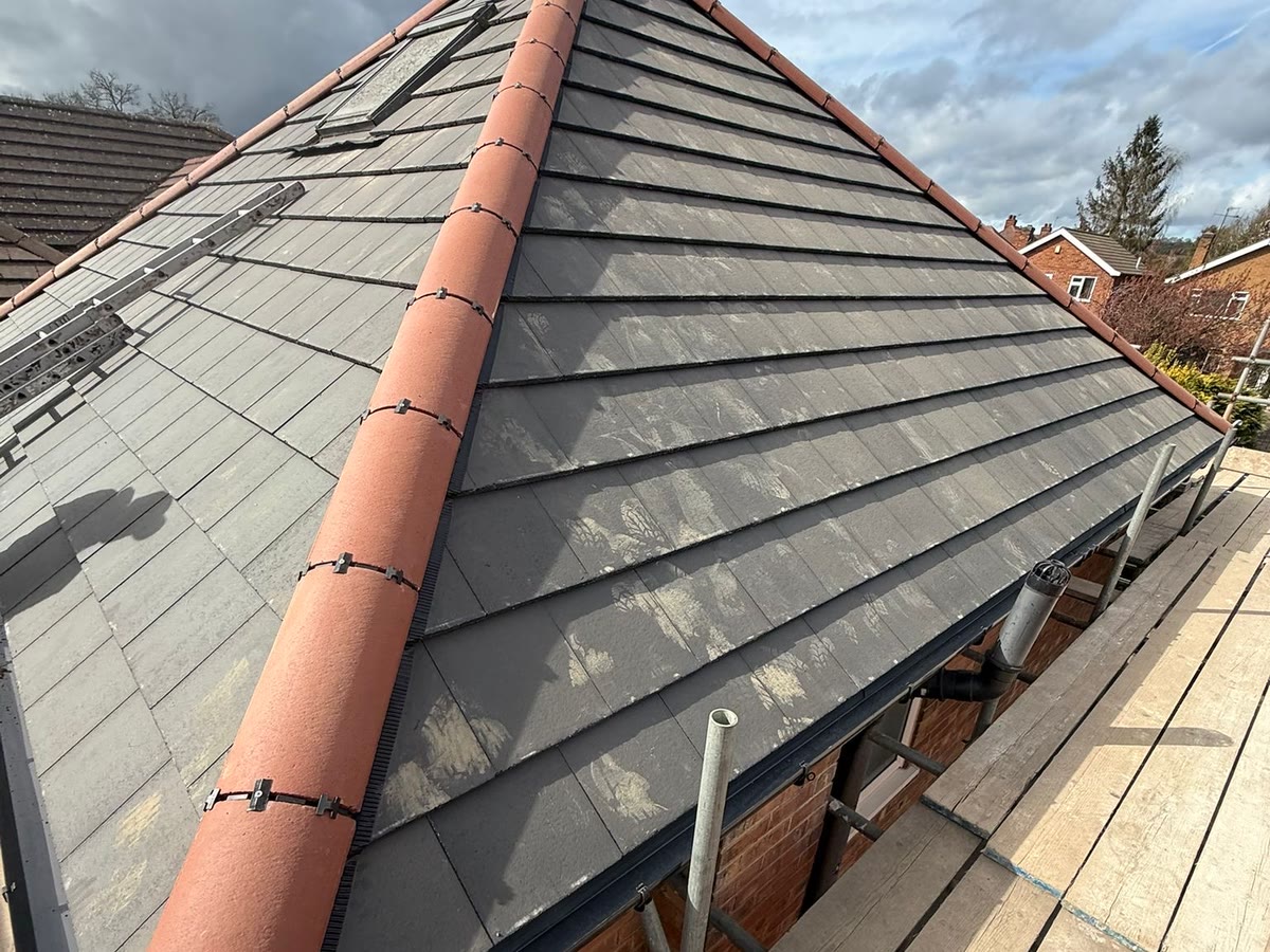 Hipped roof - grey tiles and new ridge by Derby & Nottingham Roofing
